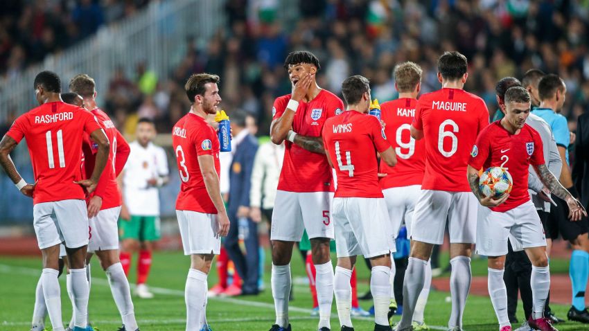 England's players wait on the pitch during a temporary interruption of the Euro 2020 Group A football qualification match between Bulgaria and England due to incidents with fans, at the Vasil Levski National Stadium in Sofia on October 14, 2019. (Photo by Stringer / AFP) (Photo by STRINGER/AFP via Getty Images)