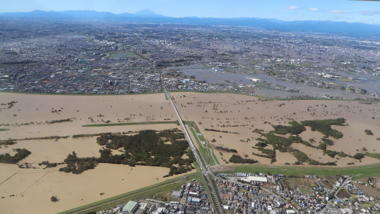 This aerial view shows the swollen Arakawa river in the aftermath of Typhoon Hagibis dividing Tokyo and Saitama prefecture on October 13, 2019.