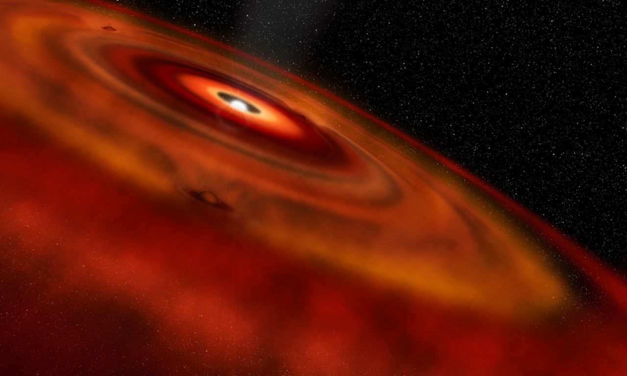 This is an artist's illustration of gas and dust disk around the star HD 163296. Gaps in the disk are likely the location of baby planets that are forming.