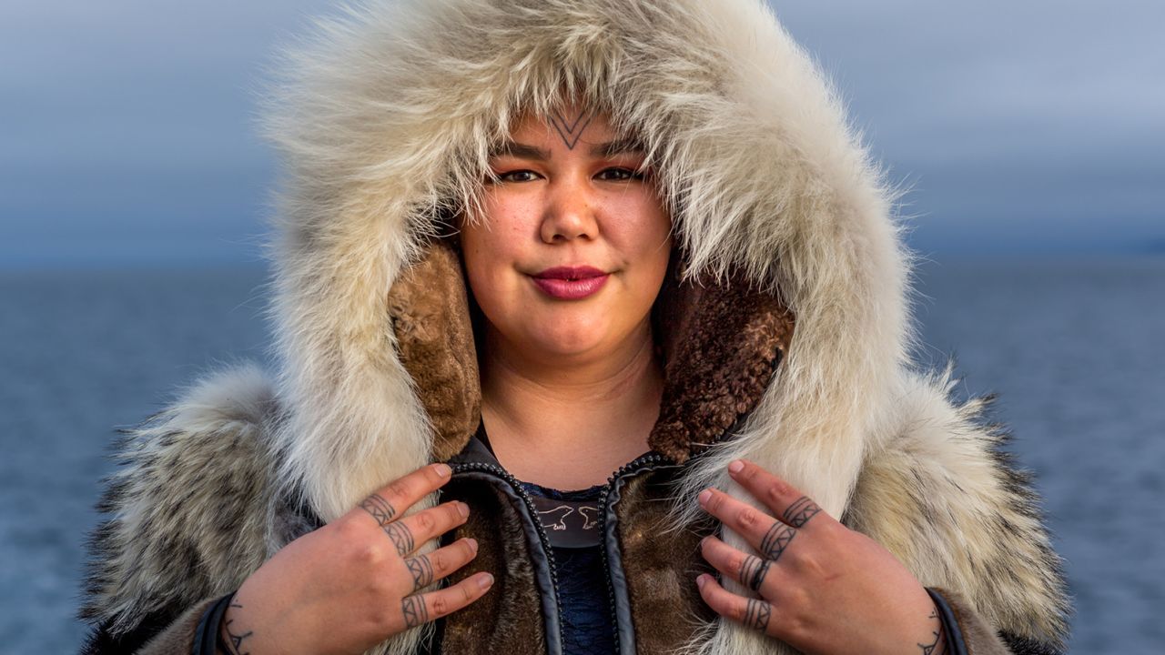 Candice Pedersen, a guide for One Ocean Expeditions in the Arctic, tells passengers that Inuit women are empowered reclaiming the tattoos for themselves.  