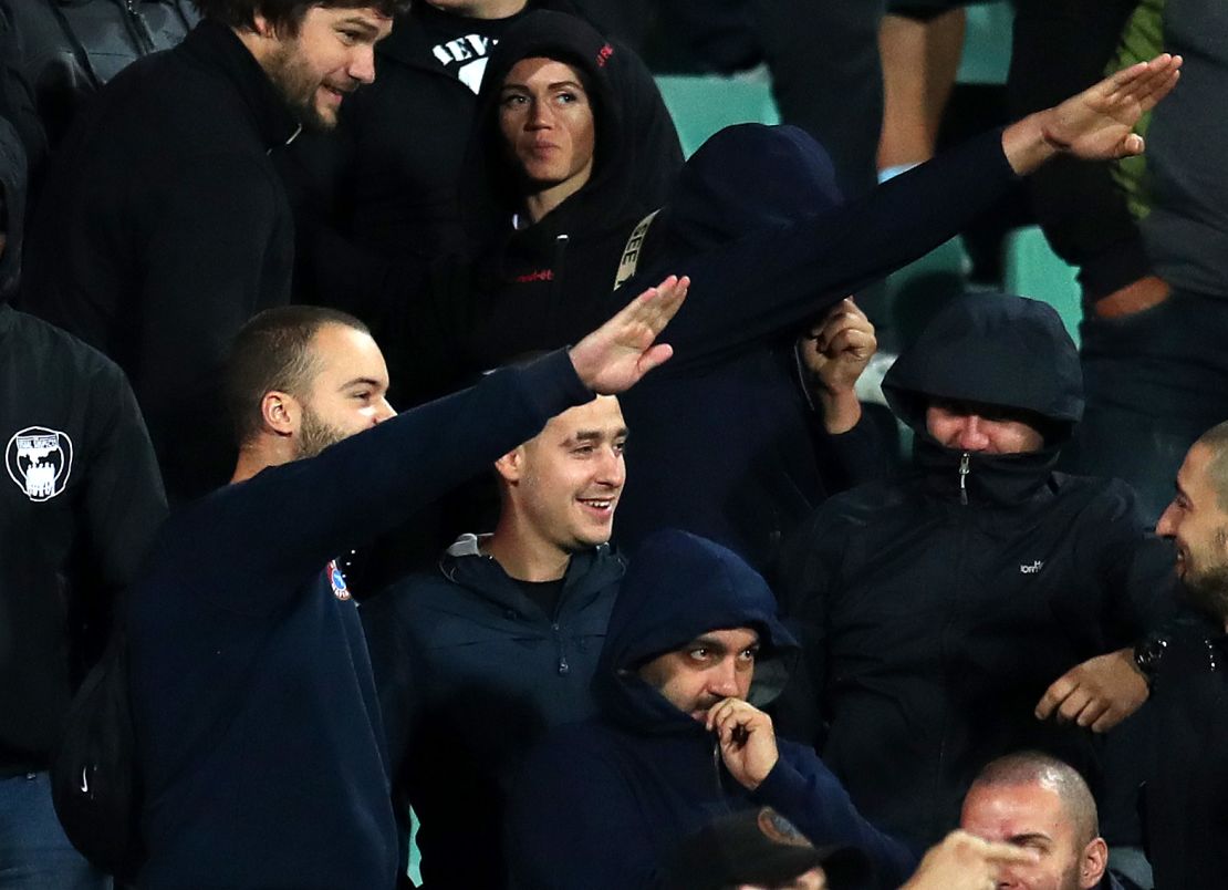 Bulgarian fans perform Nazi salutes against England.