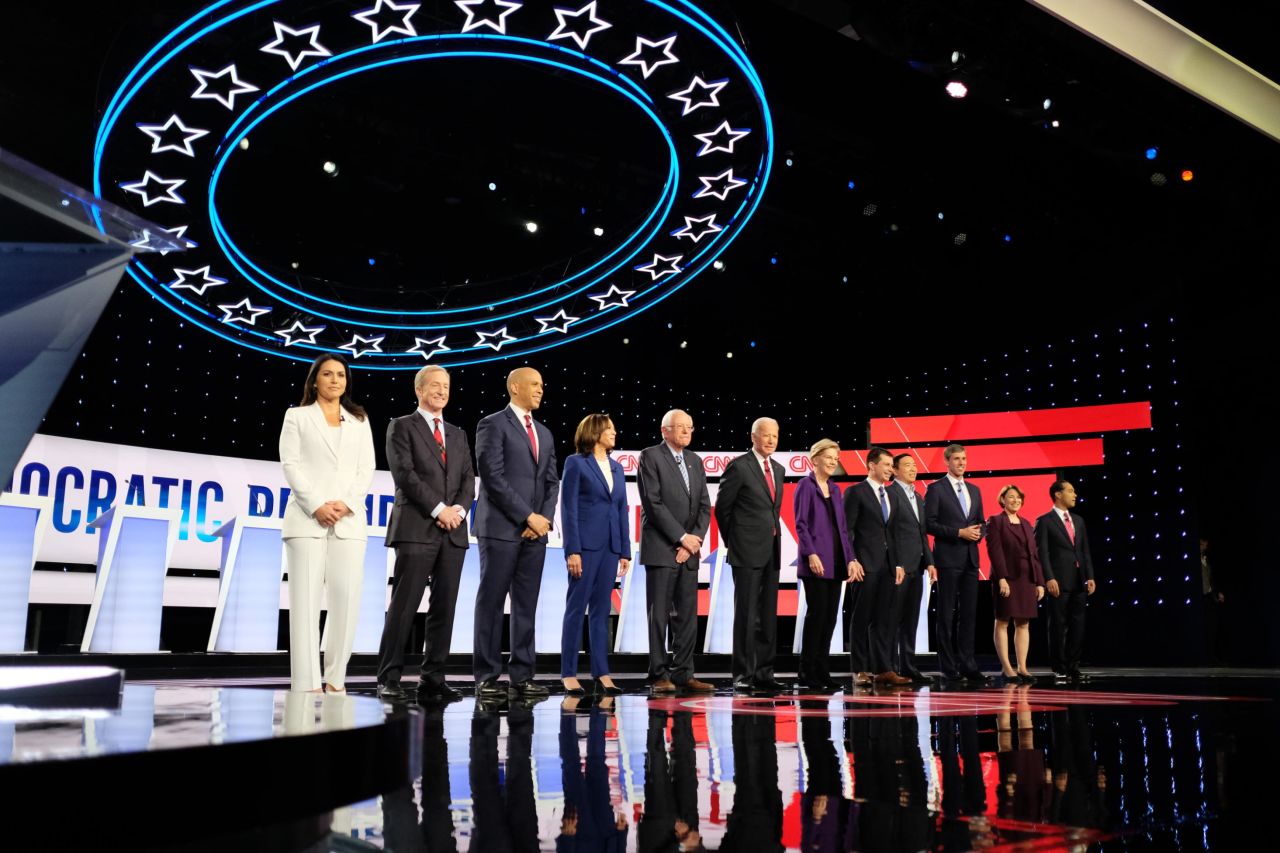 The candidates take the stage at the start of the debate.