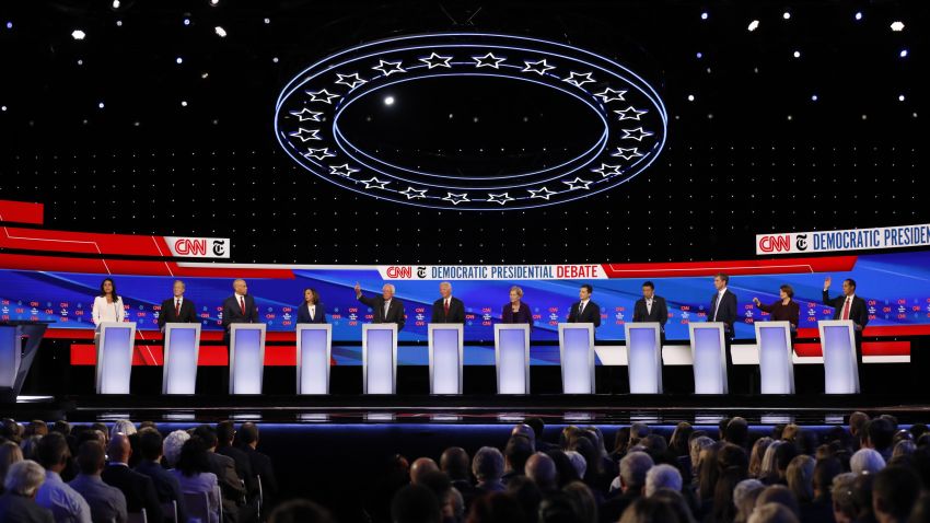 Presidential candidates Tulsi Gabbard, Tom Steyer, Cory Booker, Kamala Harris, Bernie Sanders, Joe Biden, Elizabeth Warren, Pete Buttigieg, Andrew Yang, Beto O'Rourke, Amy Klobuchar and Julián Castro participate in the Democratic debate co-hosted by CNN and The New York Times in Westerville, Ohio, on Tuesday, October 15.