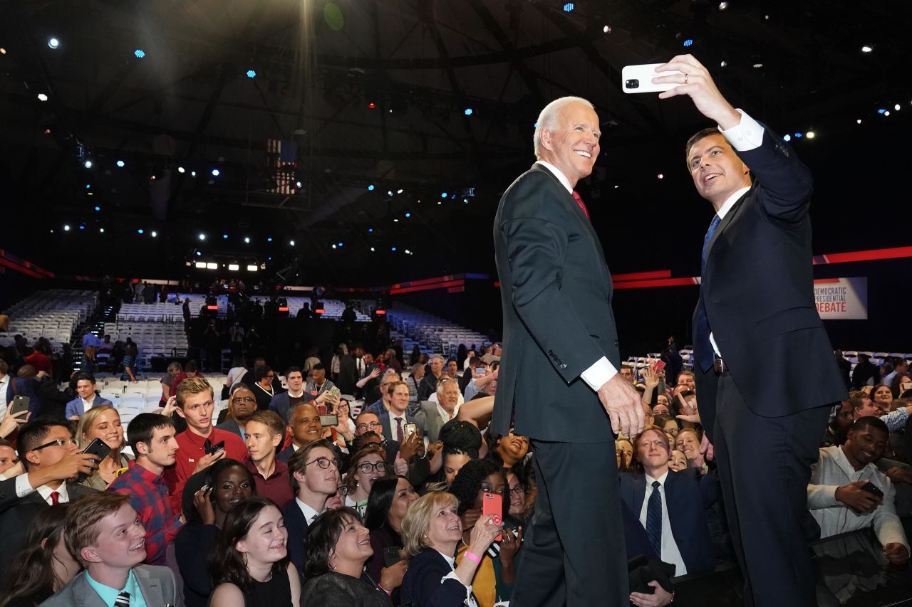Biden and Buttigieg take a selfie together after the debate.