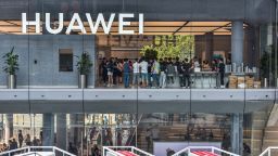 This photo taken on September 28, 2019 shows people visiting a newly-opened Huawei flagship store in Shenzhen in China's southern Guangdong province.