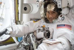NASA astronaut Christina Koch is suited up in a spacesuit. Koch, who arrived at the International Space Station in March 2019, will set the record for the longest spaceflight by a woman.