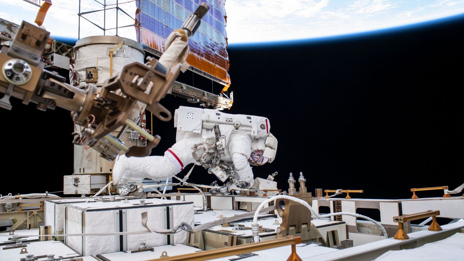 Astronaut Andrew Morgan works while tethered on the International Space Station on October 11, 2019 -- a day after elections officials say he cast his vote.