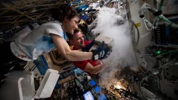 Sept. 18, 2019 - NASA astronauts Christina Koch and Andrew Morgan stow biological research samples into a science freezer located inside the U.S. Destiny laboratory module.