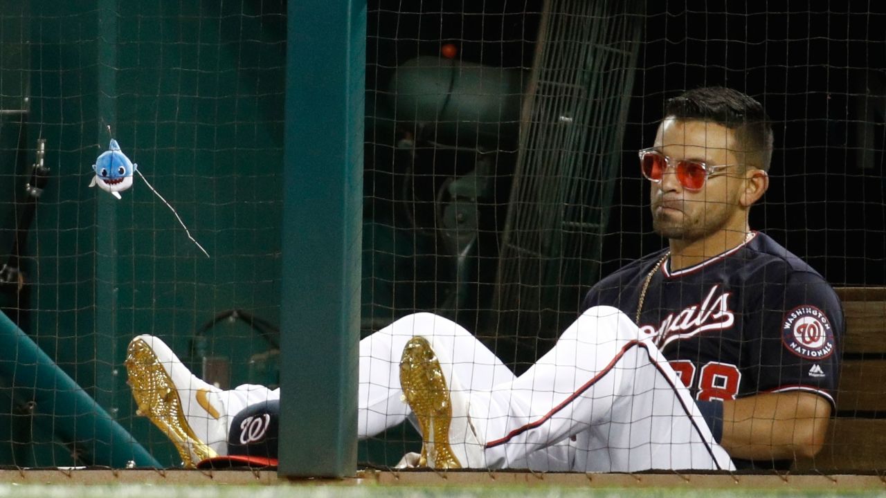 Gerardo Parra hanging with baby shark in the Nationals dugout.
