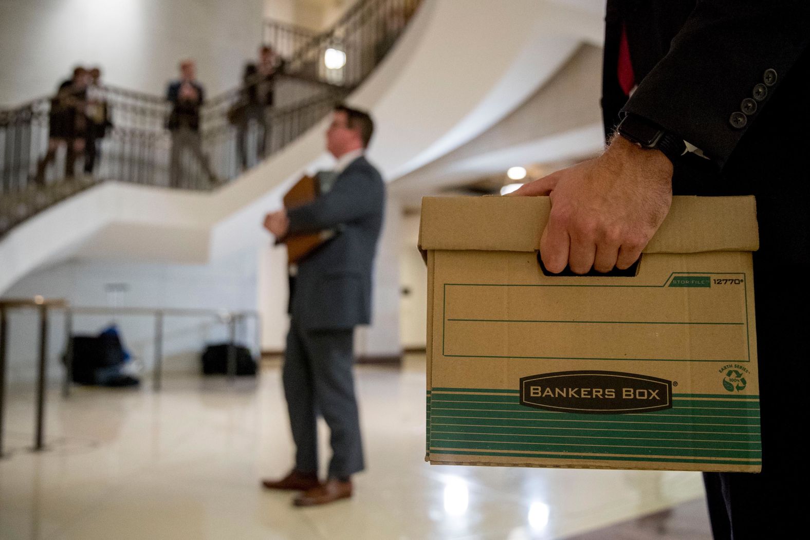 Staff members hold files as US Reps. Jim Jordan and Lee Zeldin, both Republicans, speak to reporters on October 14. It was just after Fiona Hill, Trump's former top Russia adviser, <a href="index.php?page=&url=https%3A%2F%2Fwww.cnn.com%2F2019%2F10%2F14%2Fpolitics%2Fwho-is-fiona-hill%2Findex.html" target="_blank">testified before congressional lawmakers.</a>