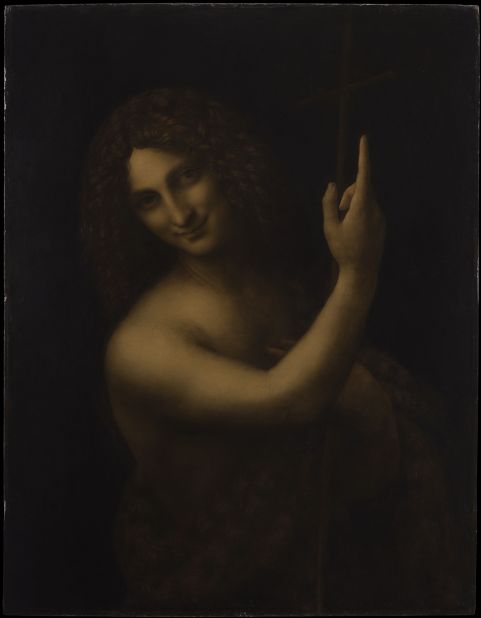 Saint John the Baptist (1452-1519), from the Louvre collection. With a signature Leonardo gesture, Saint John points upward to the sky to announce the arrival of Christ. The work exemplifies two of the painting techniques famously perfected by Leonardo: <em>chiaroscuro</em>, the juxtaposition of very dark and very bright areas, and <em>sfumato</em>, the blurring of edges and contours to make objects and figures appears more natural. The model for the painting is likely Salai -- Leonardo's longtime assistant and partner -- who embodies another Leonardo trademark, the androgynous look, while offering the same sort of enigmatic smile that has made the "Mona Lisa" famous. 