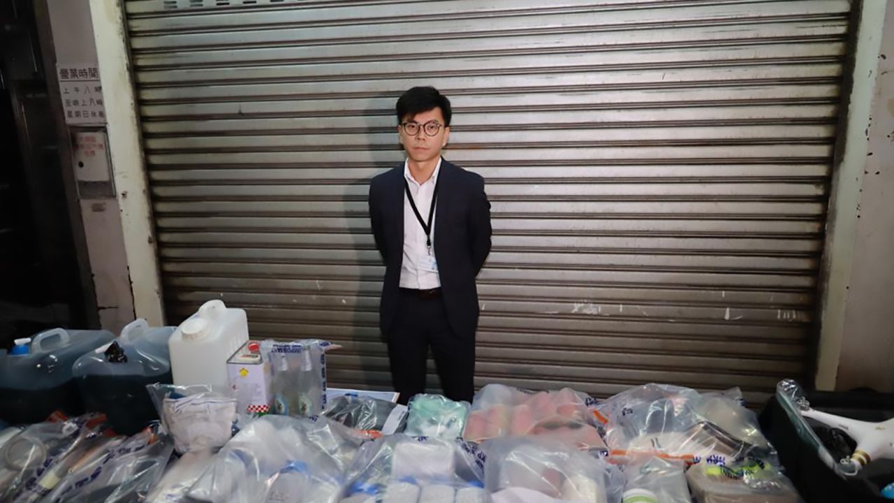 Hong Kong Police Superintendent Raymond Chou shows objects seized in a raid on October 15, 2019. 