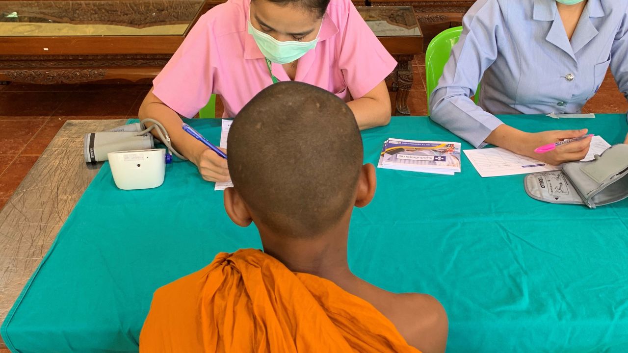 A young monk gets his health checked.