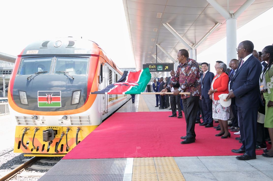 Kenyan President Uhuru Kenyatta unveils a railway project in 2019. Kenyatta has assured citizens they will receive their second vaccine doses, but some Kenyans are concerned about supply.