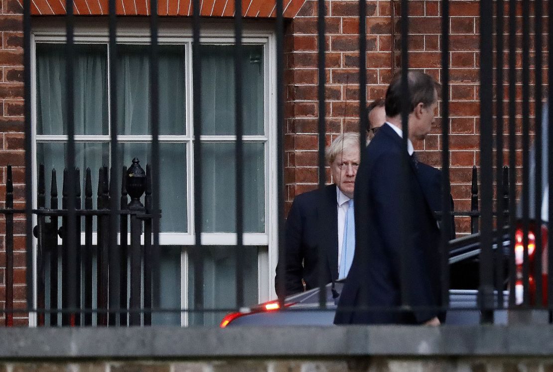 Britain's Prime Minister Boris Johnson leaves from the rear of 10 Downing Street in central London on Thursday.