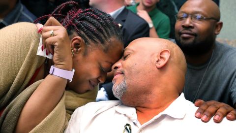 Sade Dixon's mother, Stephanie Dixon-Daniels, embraces her husband, Ron Daniels Sr., as a verdict of guilty is announced.