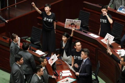 Pro-democracy lawmakers protest as Hong Kong Chief Executive Carrie Lam delivers a speech at the Legislative Council on Wednesday, October 16. Lam's annual policy address <a href=