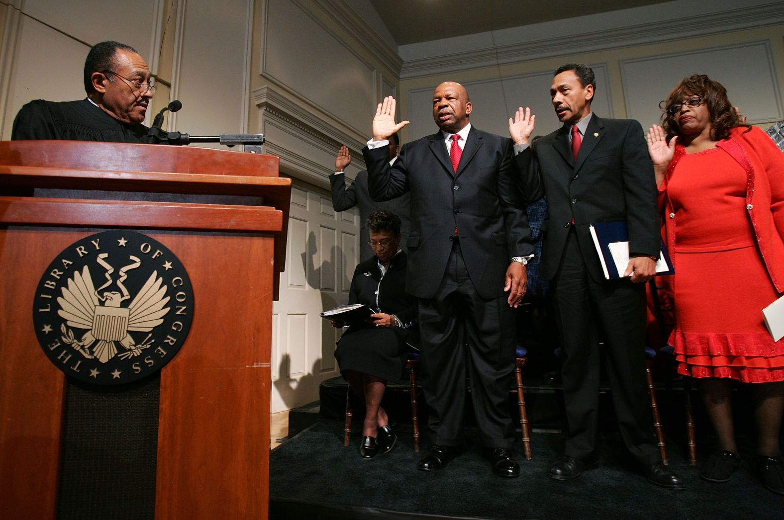 Retired North Carolina Supreme Court Chief Justice Henry Frye swears in Cummings, US Rep. Melvin Watt and US Rep. Corrine Brown as members of the Congressional Black Caucus in January 2005. Watt was replacing Cummings as chairman.