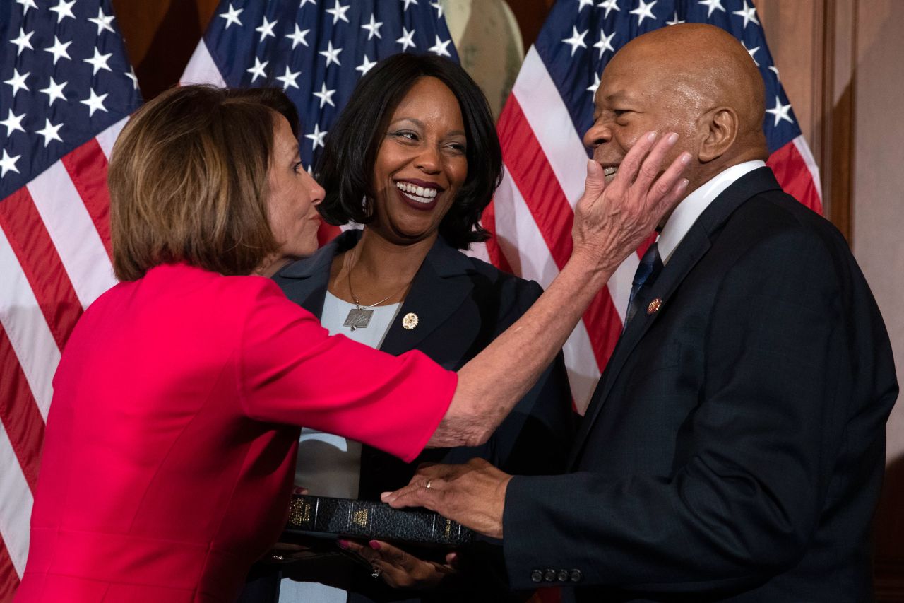 House Speaker Nancy Pelosi congratulates Cummings in January 2019 during a ceremonial swearing-in.