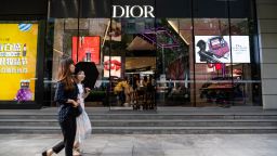 SHANGHAI, CHINA - 2019/09/07: Pedestrians walk past a French luxury goods company Christian Dior store in Shanghai. (Photo by Alex Tai/SOPA Images/LightRocket via Getty Images)