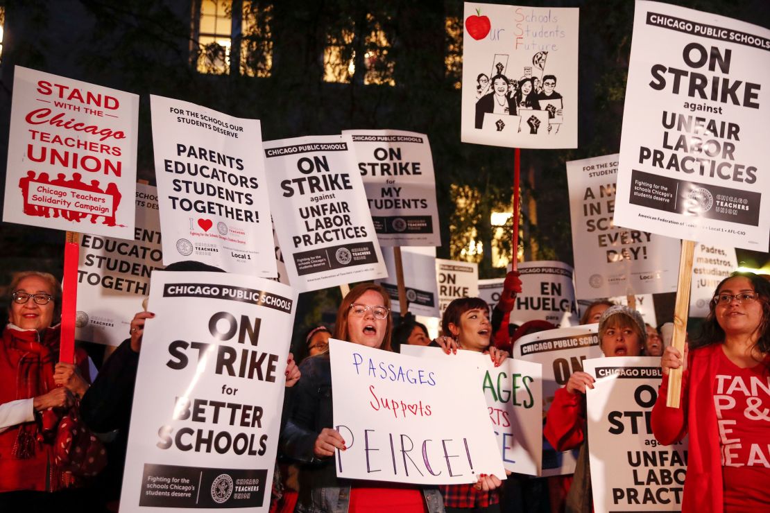 Striking teachers and supporters walk a picket line outside Peirce Elementary School on the first day of the strike by the Chicago Teachers Union on October 17 2019 in Chicago.