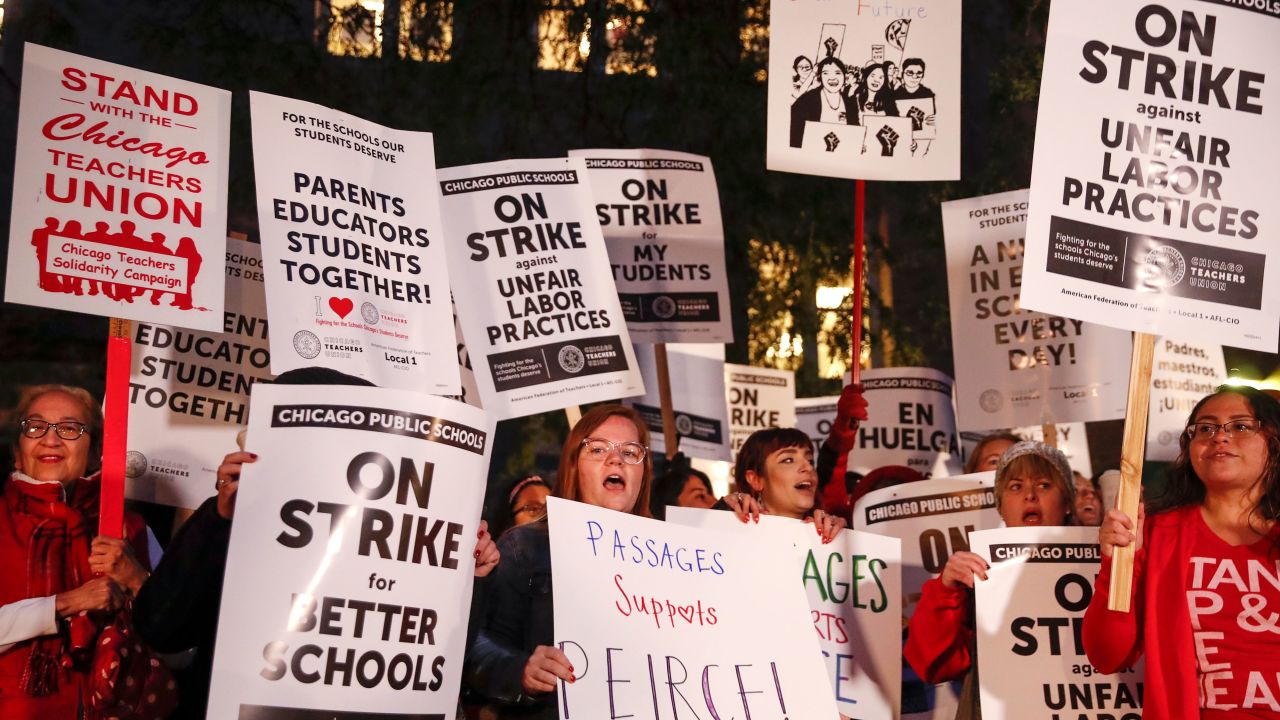 Striking teachers and supporters walk a picket line outside Peirce Elementary School on the first day of strike by the Chicago Teachers Union on October 17 2019 in Chicago, Illinois.