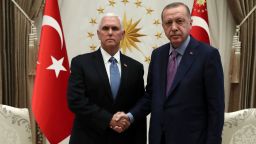 U. S. Vice President Mike Pence, left, and Turkish President Recep Tayyip Erdogan shake hands before their talks at the presidential palace, in Ankara, Turkey, Thursday, Oct. 17, 2019.  A high level U.S. delegation arrived in Turkey on Thursday for talks on a cease-fire in Syria. (Presidential Press Service via AP, Pool )
