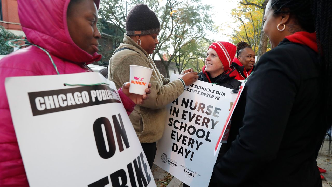 Teachers and support staff picket Thursday outside Chicago's John J. Pershing Magnet School.