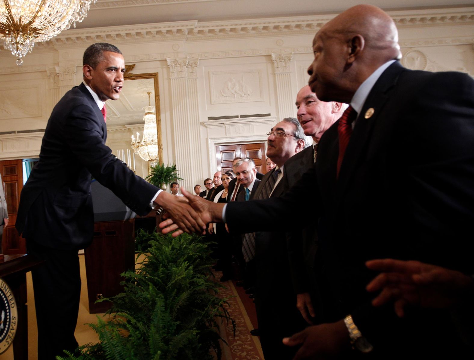 President Barack Obama shakes hands with Cummings after signing HR 4348, the Surface Transportation Bill, during a ceremony at the White House in July 2012. 