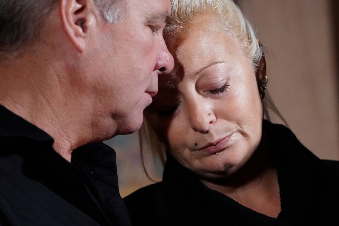 Charlotte Charles, the mother of British teen Harry Dunn, who was killed while riding his motorcycle, stands with her husband.