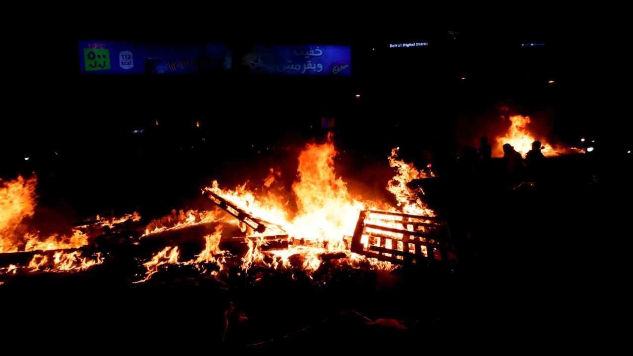 Lebanese demonstrators burn wood and debris in the capital Beirut. 