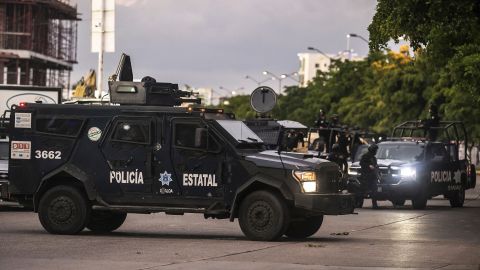 Police patrol a street of Culiacan after gunmen fought an intense battle with security forces. 