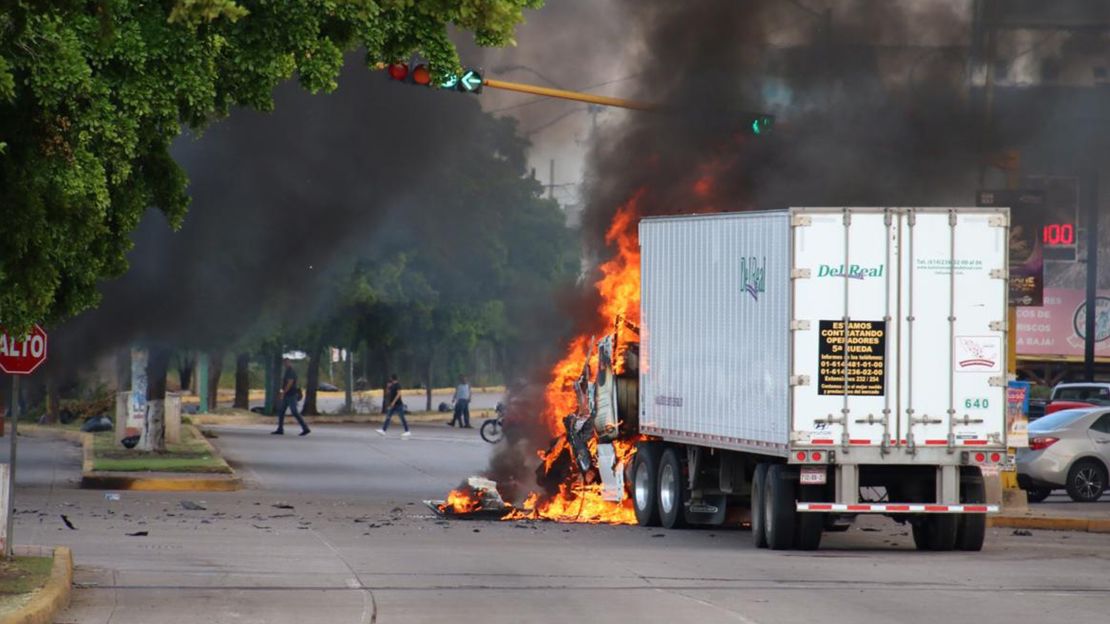 A truck burns in a Culiacan street during Thursday's battle.