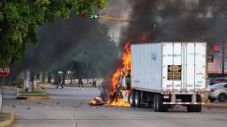 A truck burns in a street of Culiacan, state of Sinaloa, Mexico, on October 17, 2019. - Heavily armed gunmen in four-by-four trucks fought an intense battle against Mexican security forces Thursday in the city of Culiacan, capital of jailed kingpin Joaquin "El Chapo" Guzman's home state of Sinaloa. (Photo by STR / AFP) (Photo by STR/AFP via Getty Images)