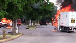 In this AFPTV screen trucks burn in a street of Culiacan, state of Sinaloa, Mexico, on October 17, 2019. - Heavily armed gunmen in four-by-four trucks fought an intense battle against Mexican security forces Thursday in the city of Culiacan, capital of jailed kingpin Joaquin "El Chapo" Guzman's home state of Sinaloa. (Photo by STR / AFP) (Photo by STR/AFP via Getty Images)