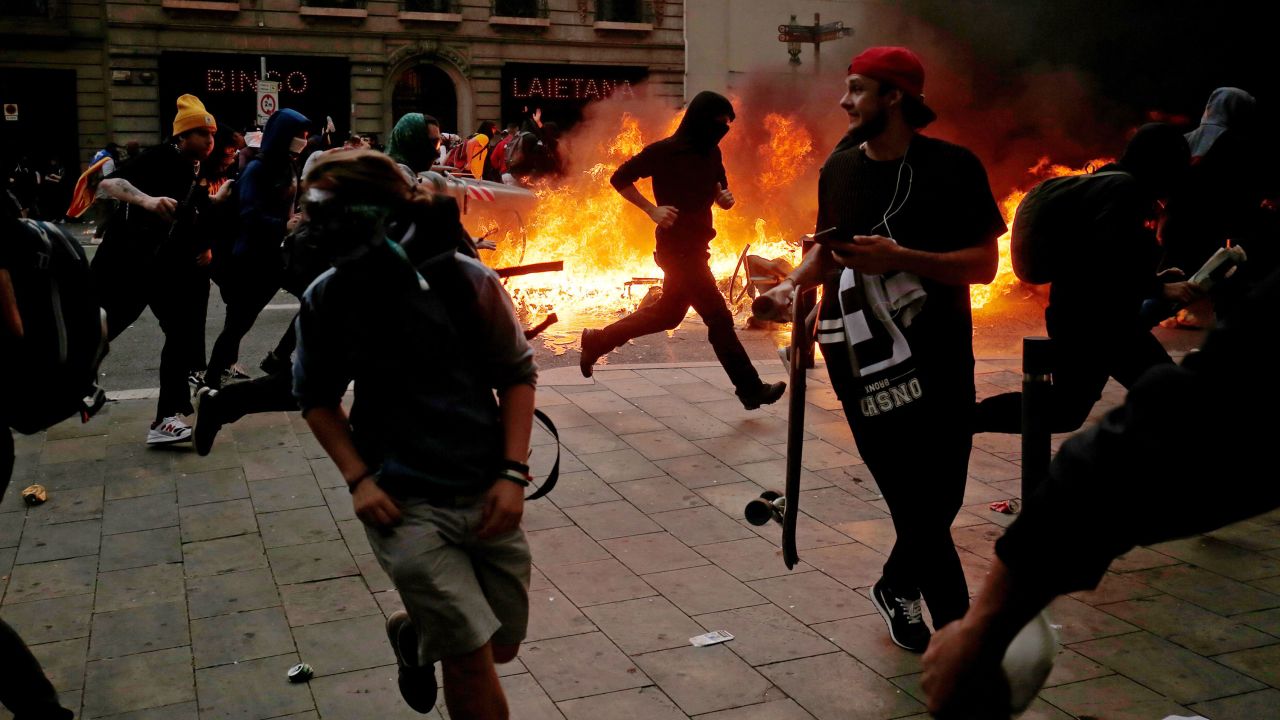 Protesters clash with police in central Barcelona on Friday.
