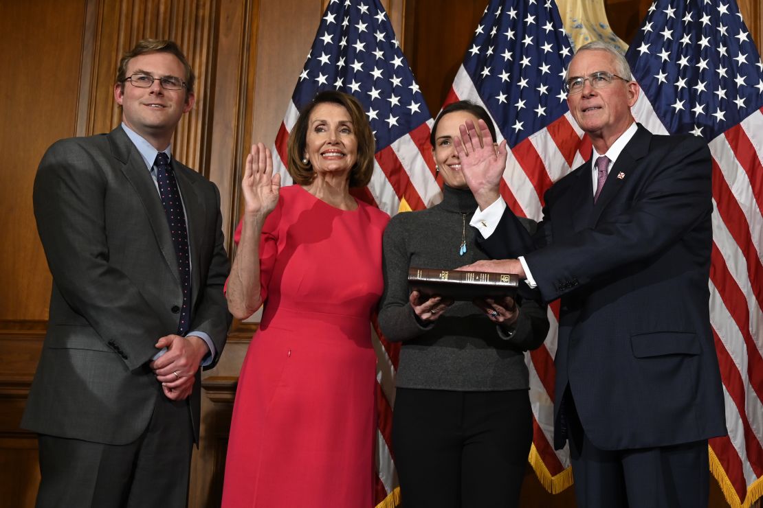 House Speaker Nancy Pelosi poses during a ceremonial swearing-in with Rooney, at right, on Capitol Hill in Washington in January.