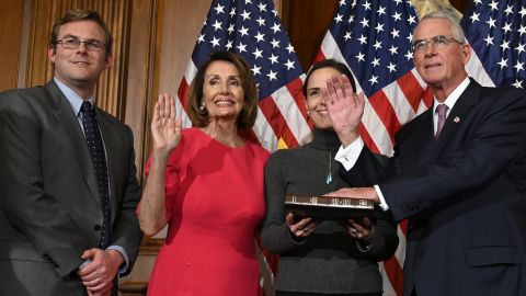 House Speaker Nancy Pelosi poses during a ceremonial swearing-in with Rooney, at right, on Capitol Hill in Washington in January.