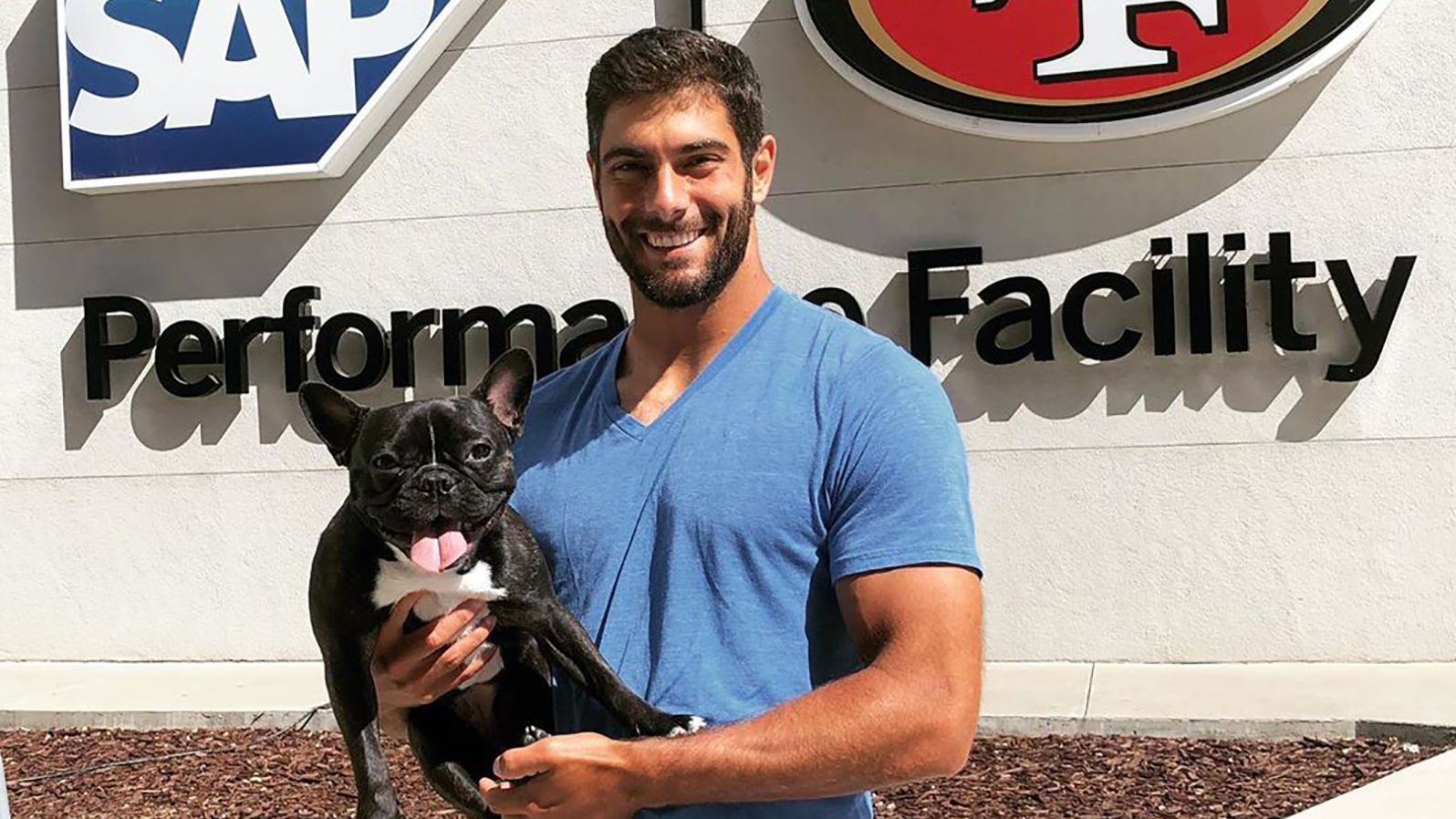 Quarterback Jimmy Garoppolo hangs with Zoë at the Niner's training facility.