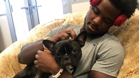 Linebacker Azeez Al-Shaair cuddles with Zoë.