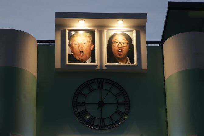 <strong>Dear leaders:</strong> Portraits of United States President Donald Trump and comedian Kim Gyeong-jin hang outside Pyongyang Pub. The bar's owner said the portraits don't have a deep meaning — they're just intended to induce a laugh.