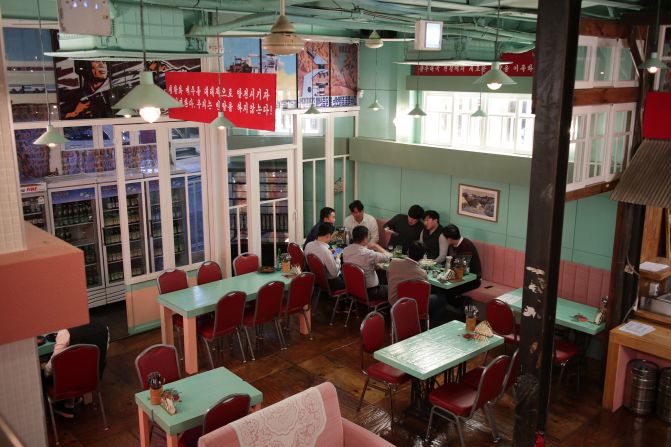 <strong>Hanging out:</strong> Patrons inside Pyongyang Pub, which features decor inspired by North Korean houses, stores and train stations.