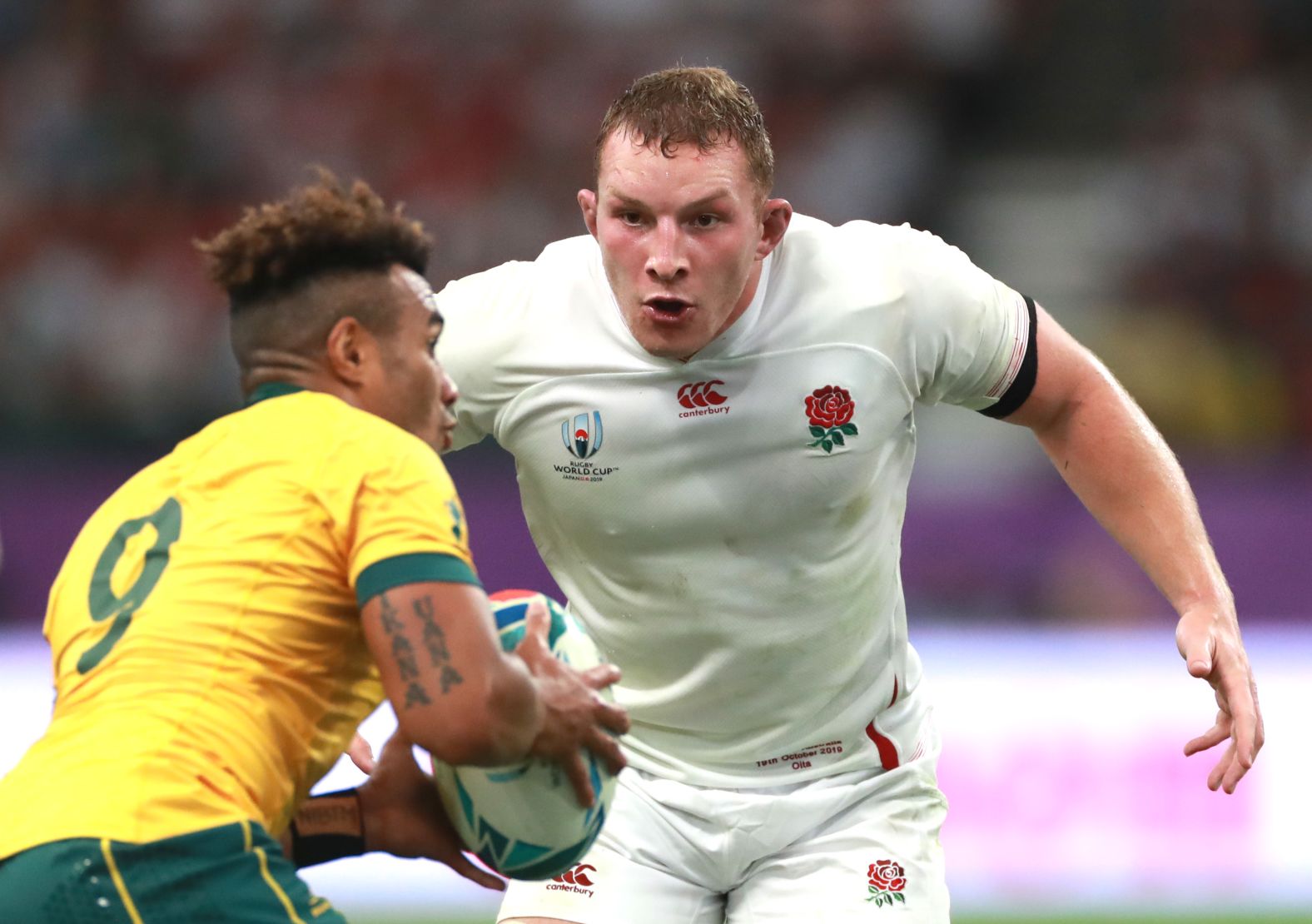 Sam Underhill of England looks to tackle Will Genia of Australia their quarterfinal match. England won 40-16.