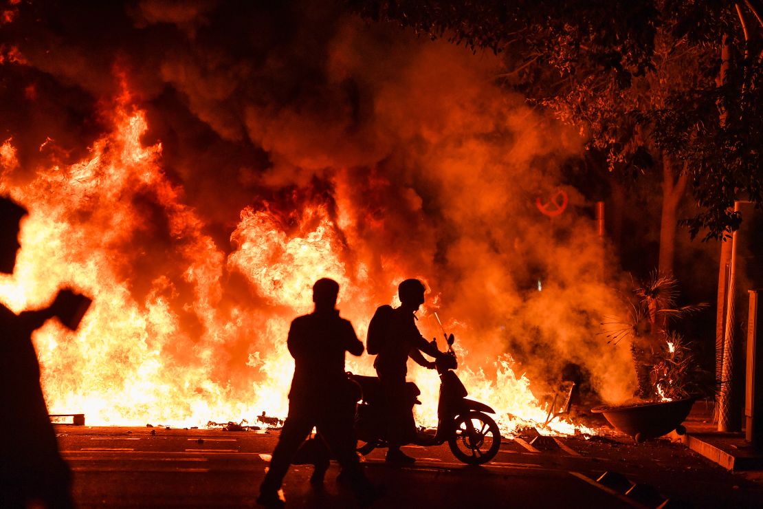 Fires burn in Barcelona on Friday  following another evening of protests 