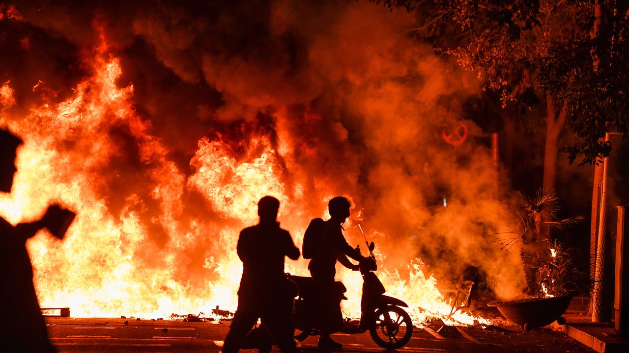 Fires burn in Barcelona on Friday  following another evening of protests 