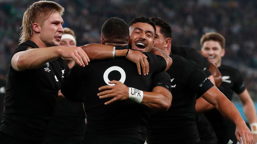 New Zealand's scrum-half Aaron Smith (C) is hugged by New Zealand's fly-half Richie Mo'unga (2nd R) after scoring a try during the Japan 2019 Rugby World Cup quarter-final match between New Zealand and Ireland at the Tokyo Stadium in Tokyo on October 19, 2019. (Photo by Odd ANDERSEN / AFP) (Photo by ODD ANDERSEN/AFP via Getty Images)