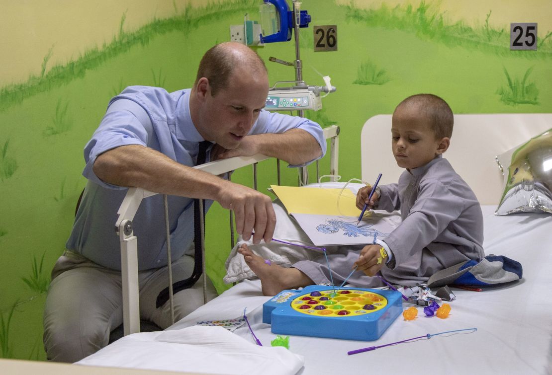 Prince William plays with 5-year-old Muhammed Sameer, a patient at Shaukat Khanum Memorial Cancer Hospital in Lahore on Thursday.