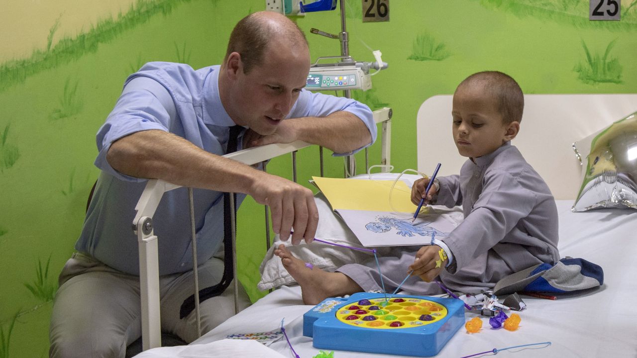 Prince William plays with 5-year-old Muhammed Sameer, a patient at Shaukat Khanum Memorial Cancer Hospital in Lahore on Thursday.