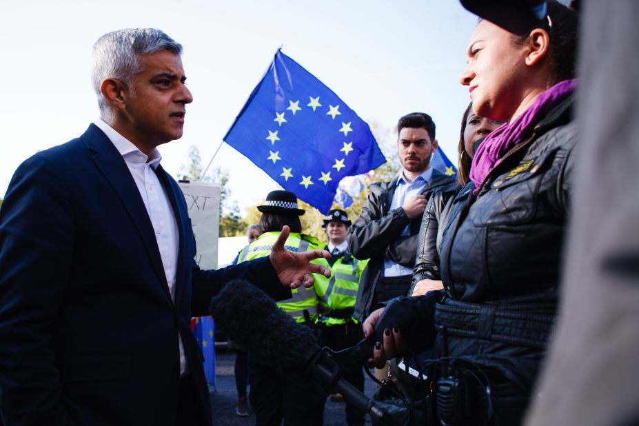 Mayor of London Sadiq Khan, who supports a second referendum, gives a media interview as demonstrators gather on Park Lane.
