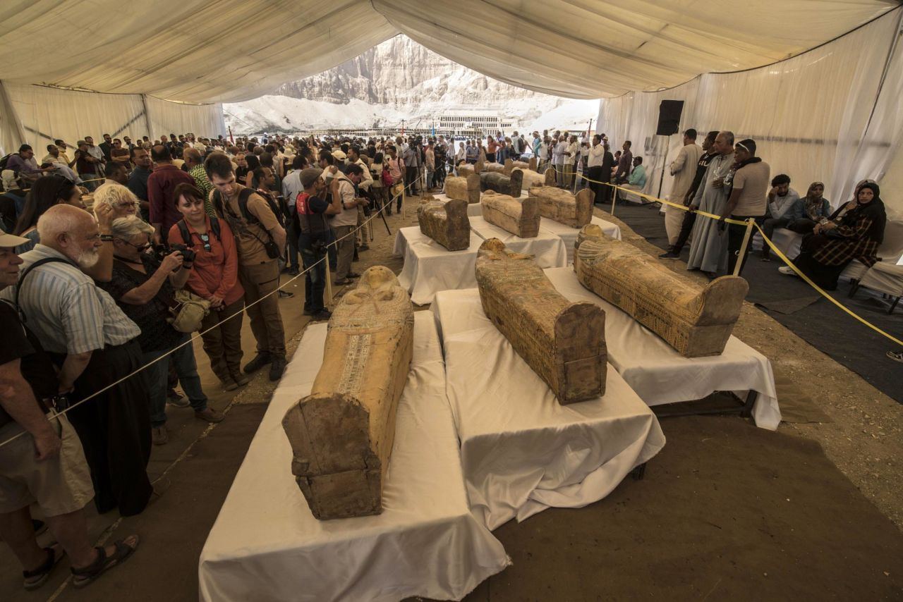 Tourists view the newly discovered coffins at Hatshepsut Temple on October 19, 2019.